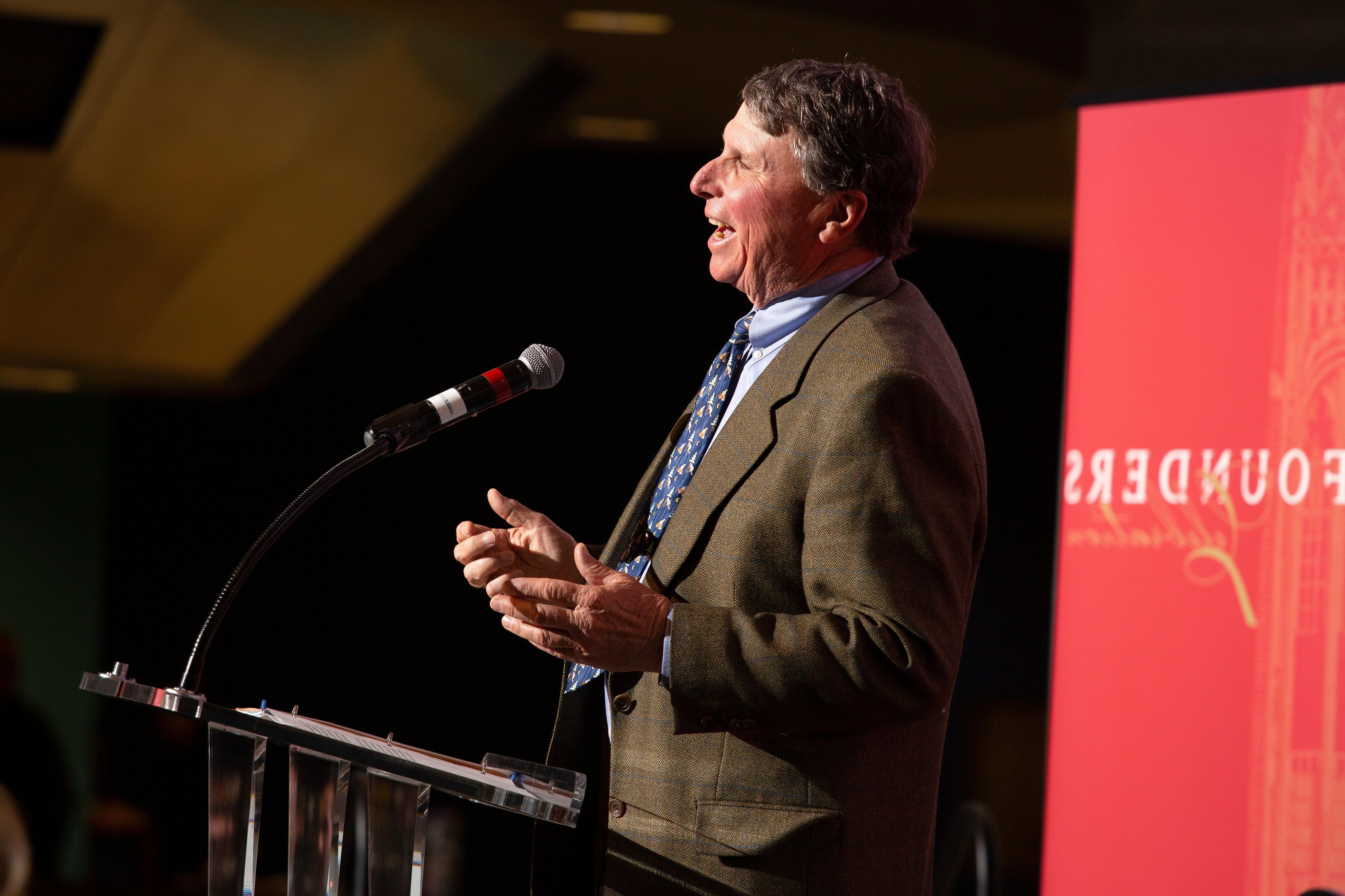 james kennedy speaking at podium